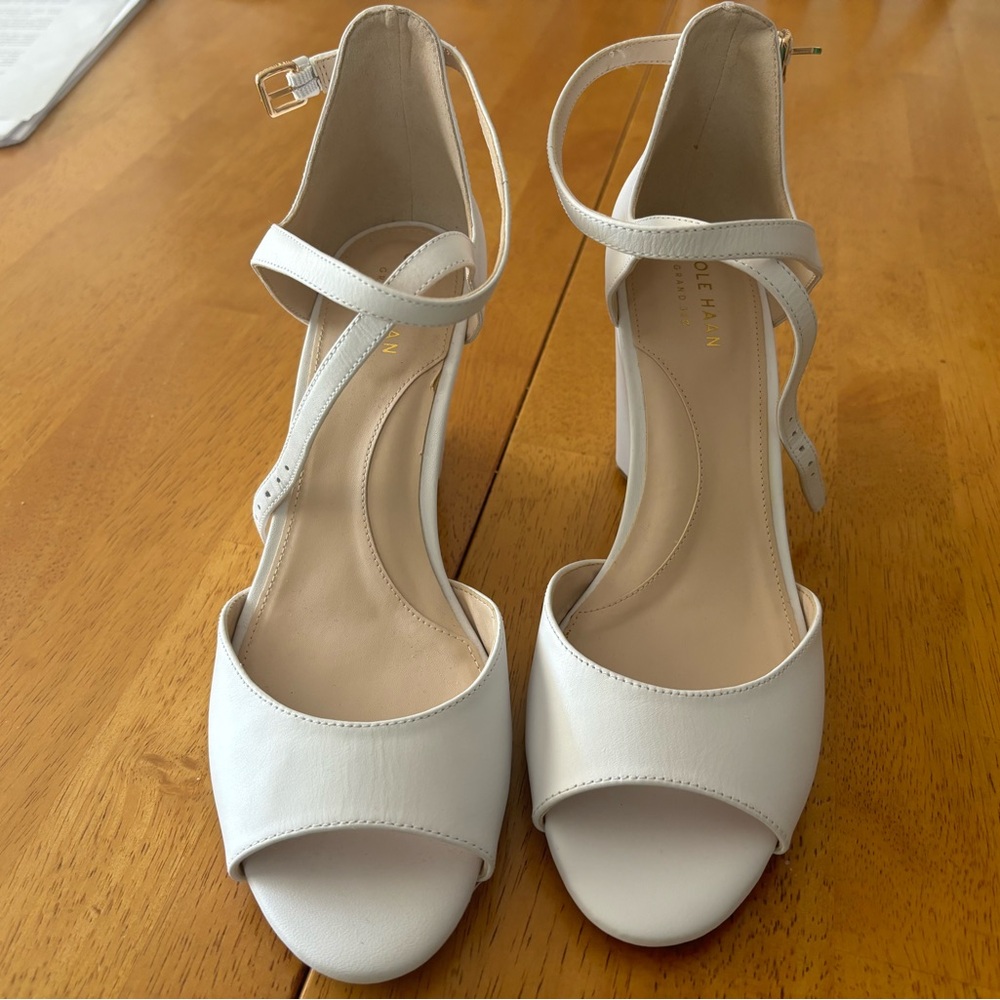 Pristine (never worn) wedge sandals.  Leather upper